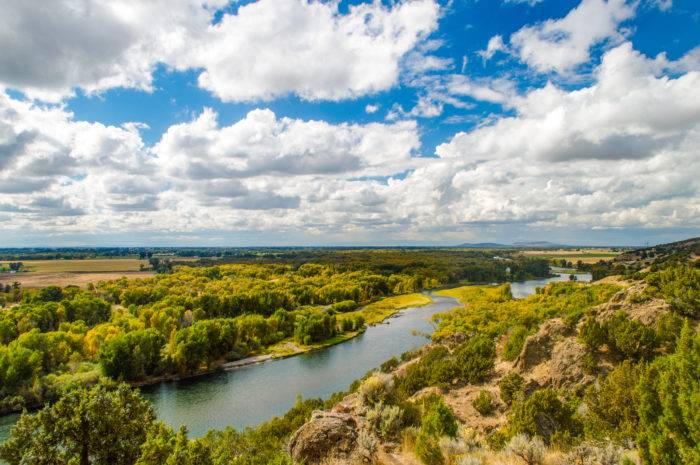 SCENIC RIVER VALLEY WITH FALL COLORS