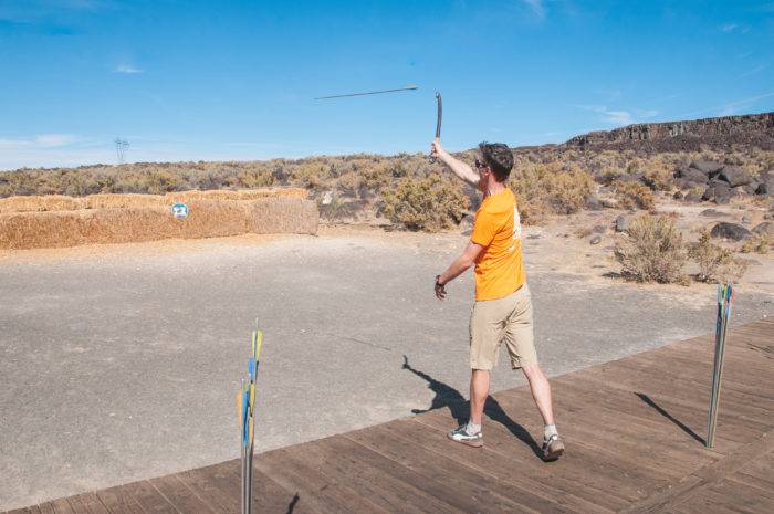 man throwing atlatl