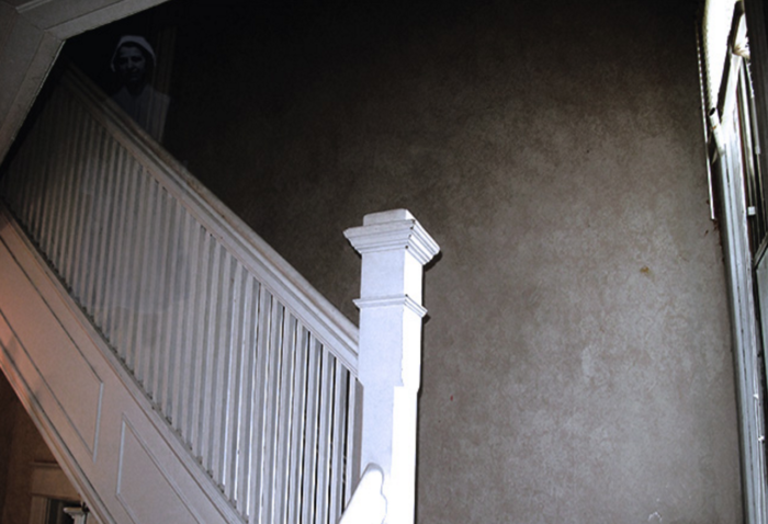 A close-up of a spooky white staircase at the Haunted History Tour. 