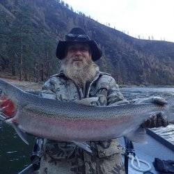 man holding large steelhead