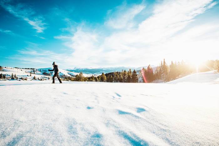 A person snowshoeing in Victor.