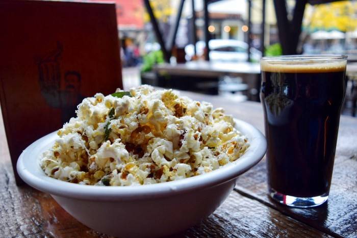 beer and bowl of popcorn.