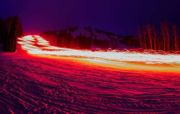 Light trail leftover from torchlight parade at night at Targhee Resort