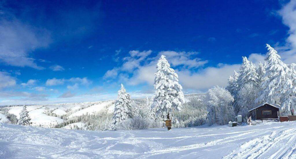 Bluebird skies overlook snowcovered fatbike trails at Kelly Canyon Ski Area.