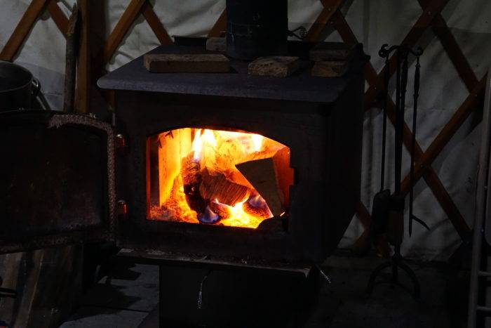 Closeup of glowing fire in the wood stove.