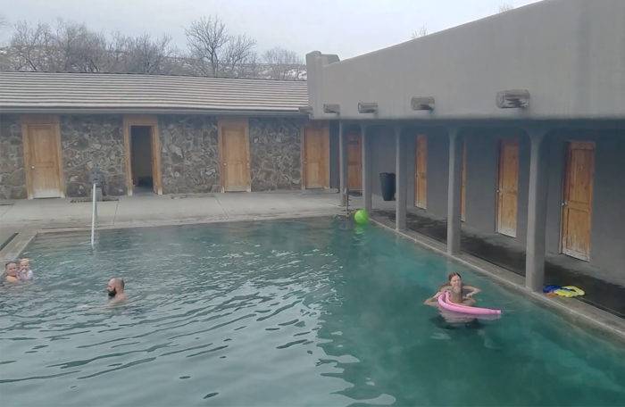 people lounging in a commercial hot pool