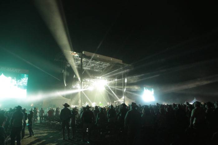 fans by an outdoor stage