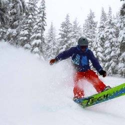 SNOWBOARDER ON MOUNTAIN