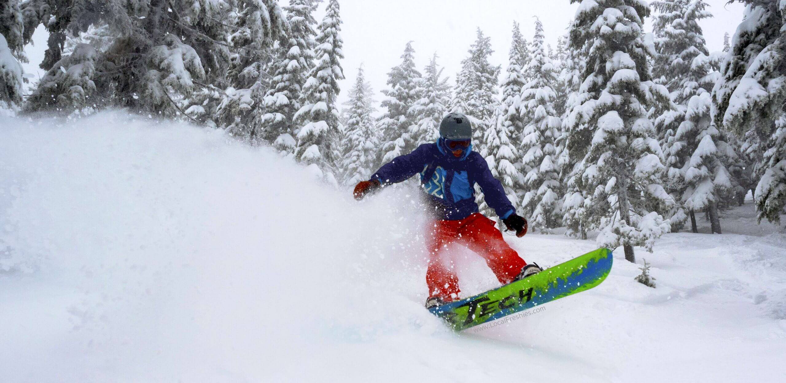 SNOWBOARDER ON MOUNTAIN