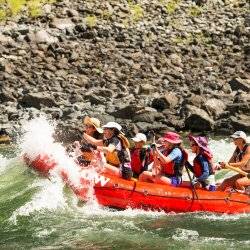 group of rafters going through a whitewater rapid