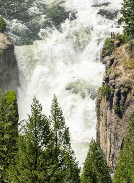 waterfall running between two canyon walls