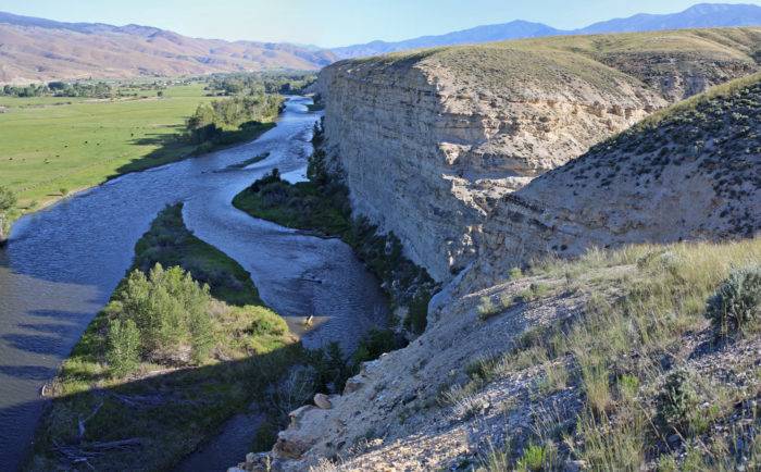 river running along cliffs