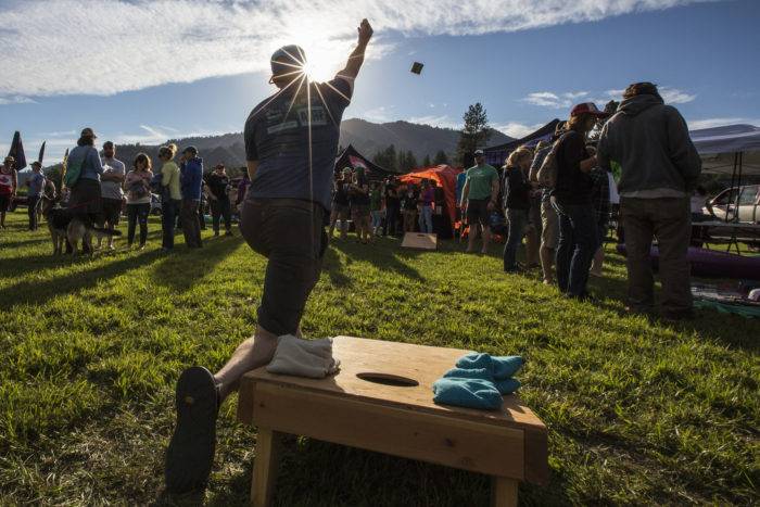 man playing a yard game