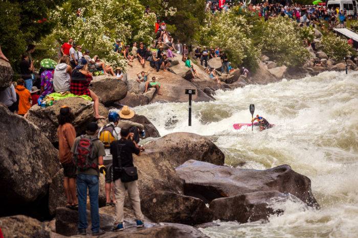 people standing along river bank