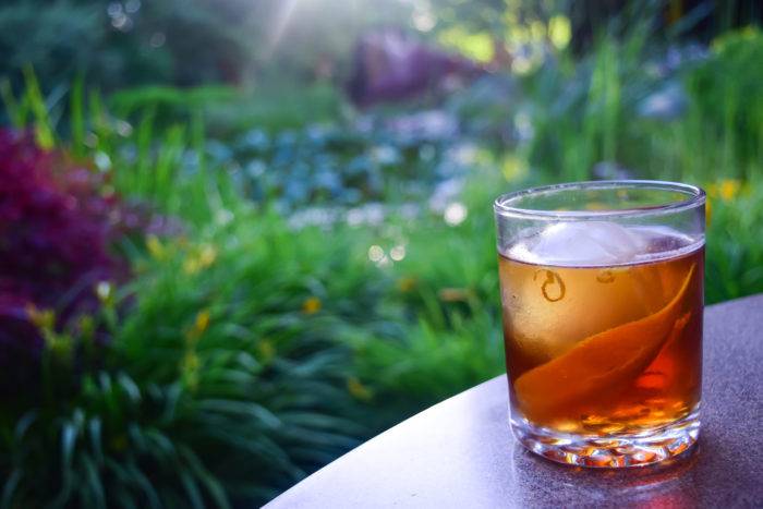 cocktail glass with grass in background