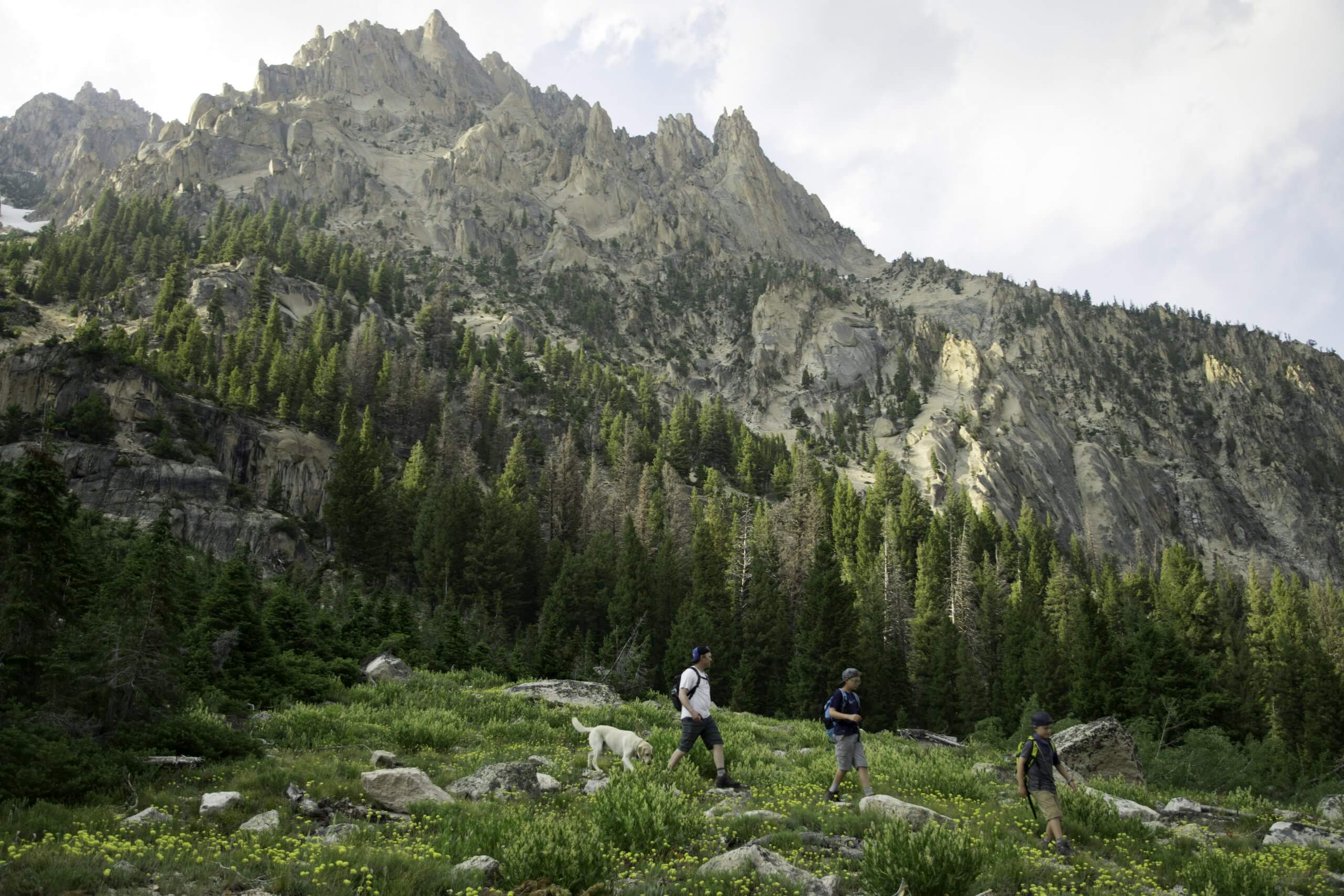 family hiking in rugged mountains