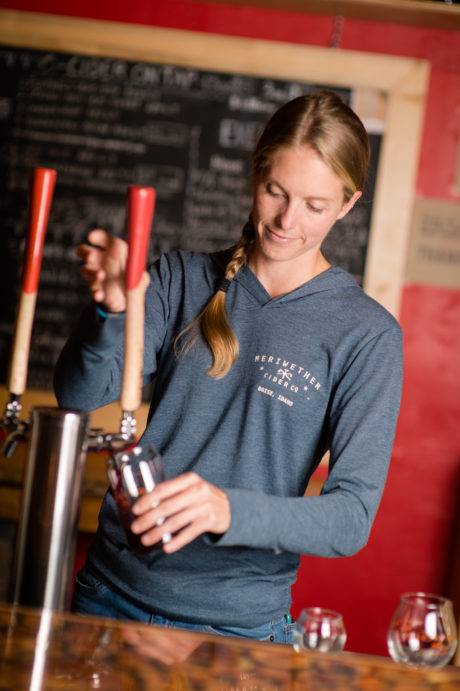 woman pouring cider