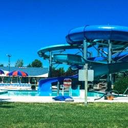 Two blue waterslides at Hamilton-Lowe Aquatics Center.