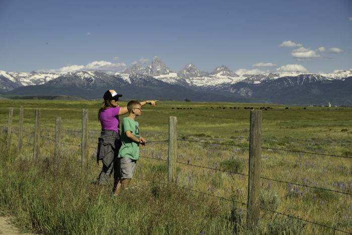 woman and child looking at mountains