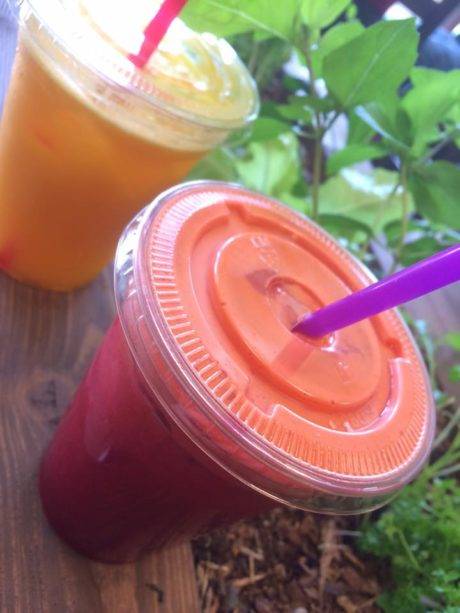 two juices in plastic cups