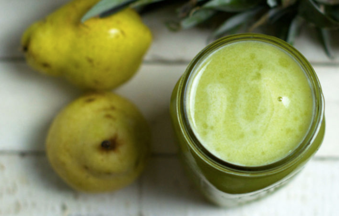 green juice next to pears