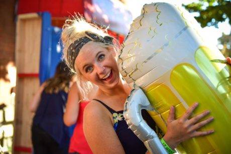 woman holding beer balloon