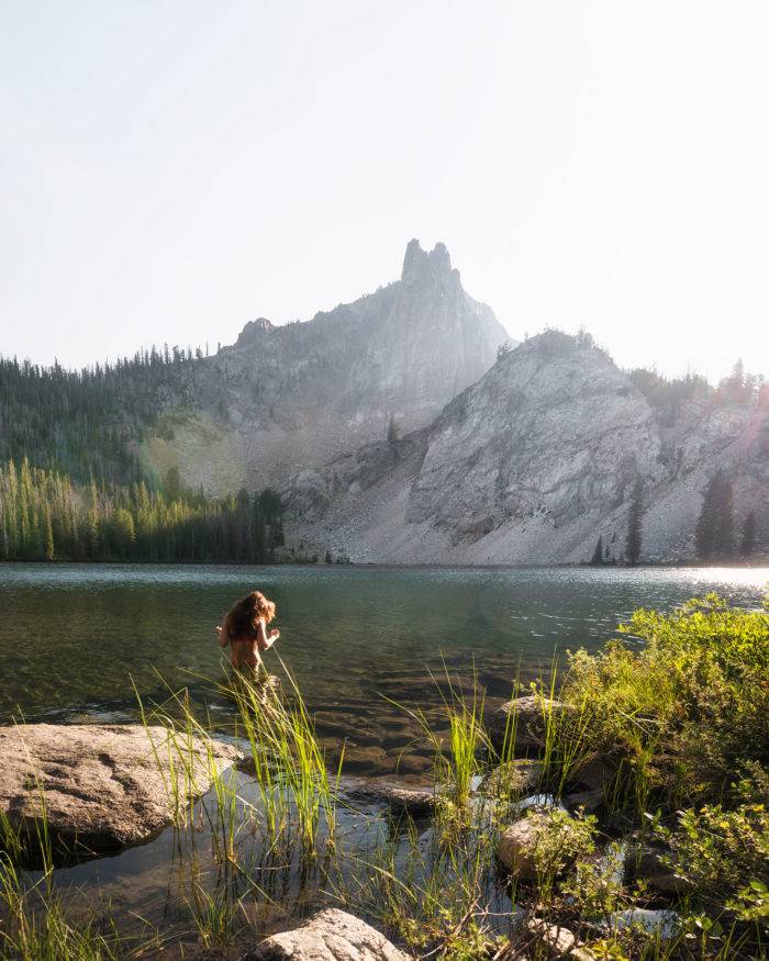 woman swimming in alpine lake