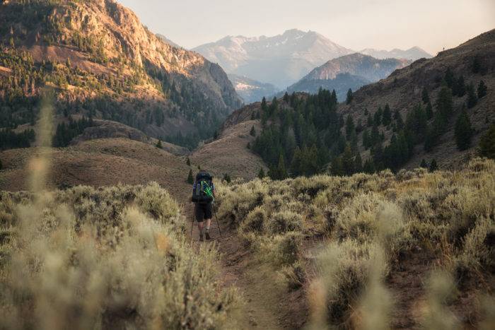 hikers on trail surrounded by sagebrush