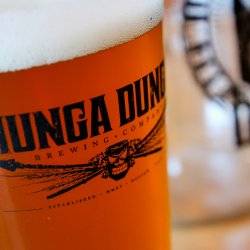 brew filling a Hunga Dunga Brewing Co. logoed pint glass.