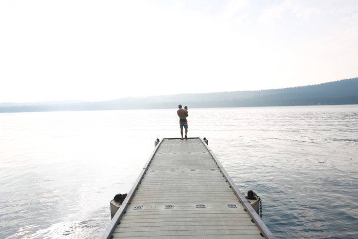 dad and child on dock