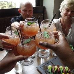 group of people raising glasses.