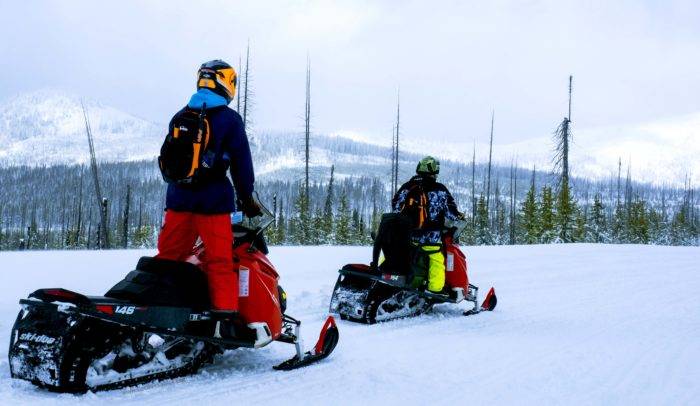 two people on a snowmobile