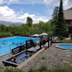 People enjoy several different pools set in a scenic landscape at Easley Hot Springs.