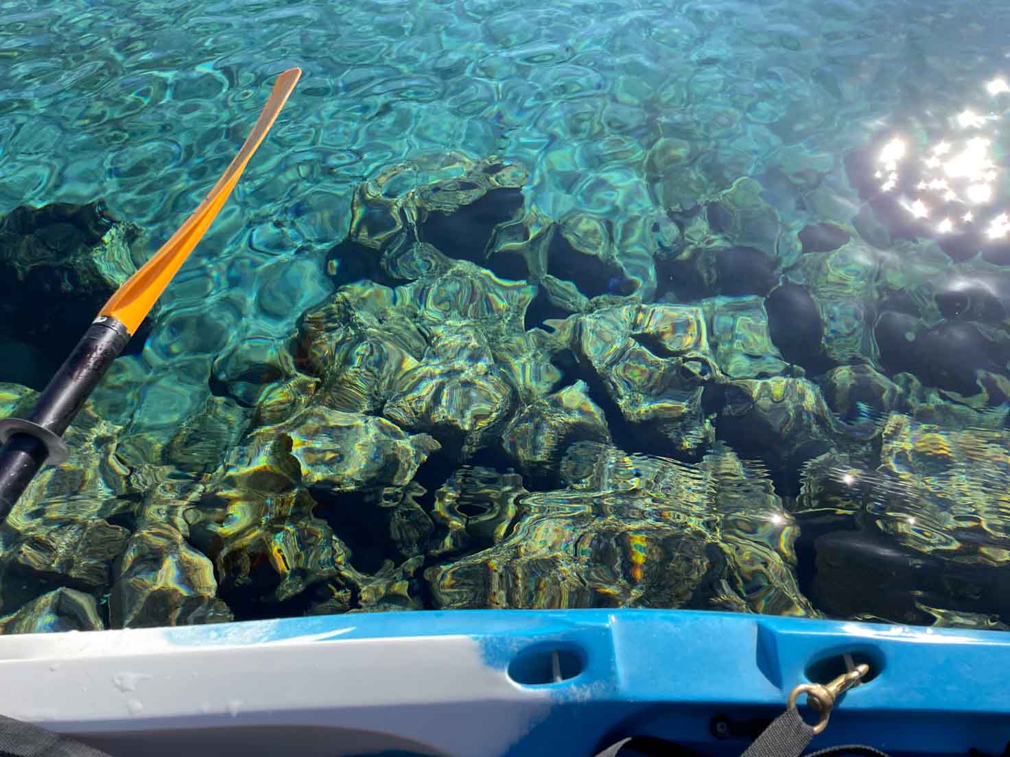 A view from a kayak at the jeweled turquoise waters at Blue Heart Springs.