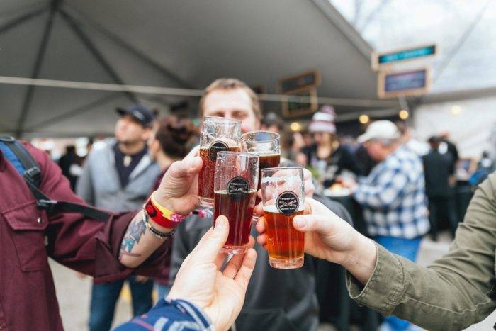 people raising a glass