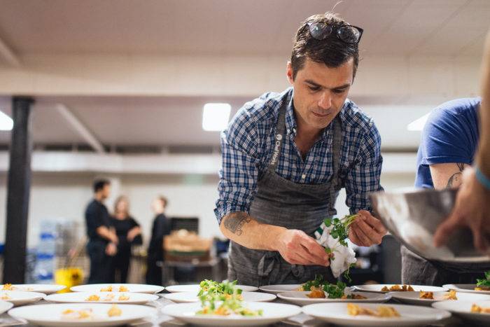 chef putting food on plates