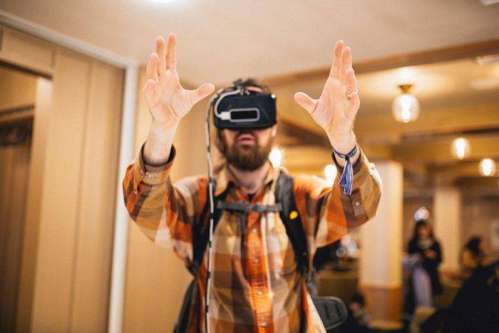 man using virtual reality headset.