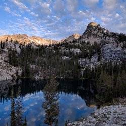 mountains in a reflective lake-The Natural Beauty of Camping in the Idaho National Forests