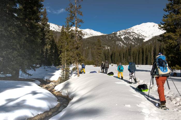 people snowshoeing