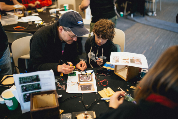 people working on computer parts