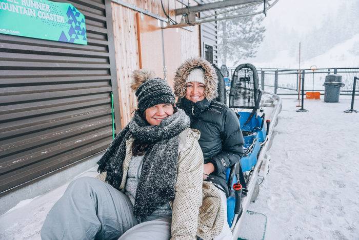 two people on a roller coaster seat