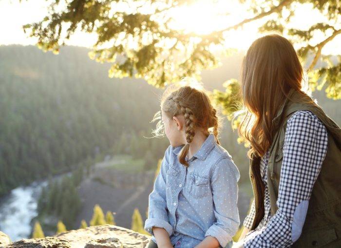 woman and child sitting next to each other