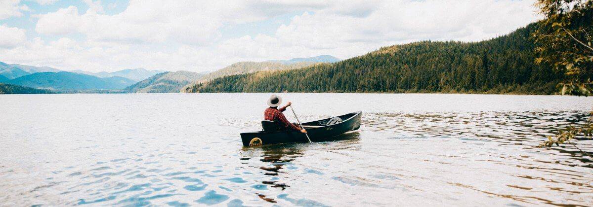 Person in a canoe on Priest Lake.