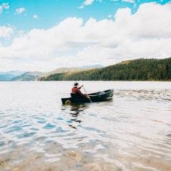 Person in a canoe on Priest Lake.