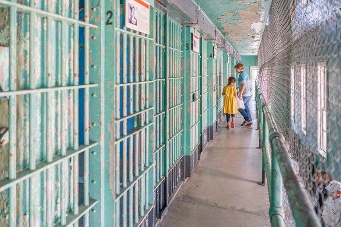 kids walking in historical prison