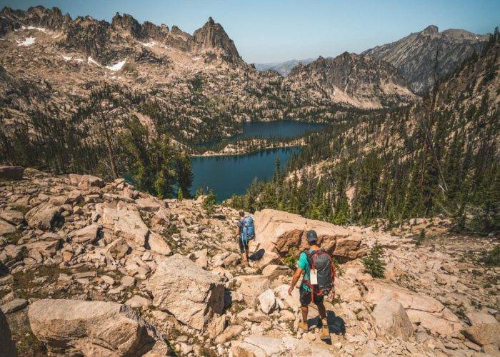 people hiking alpine lake.