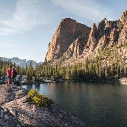 hikers at alpine lake