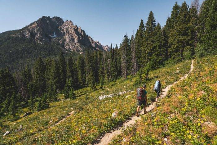 people hiking mountain ridge