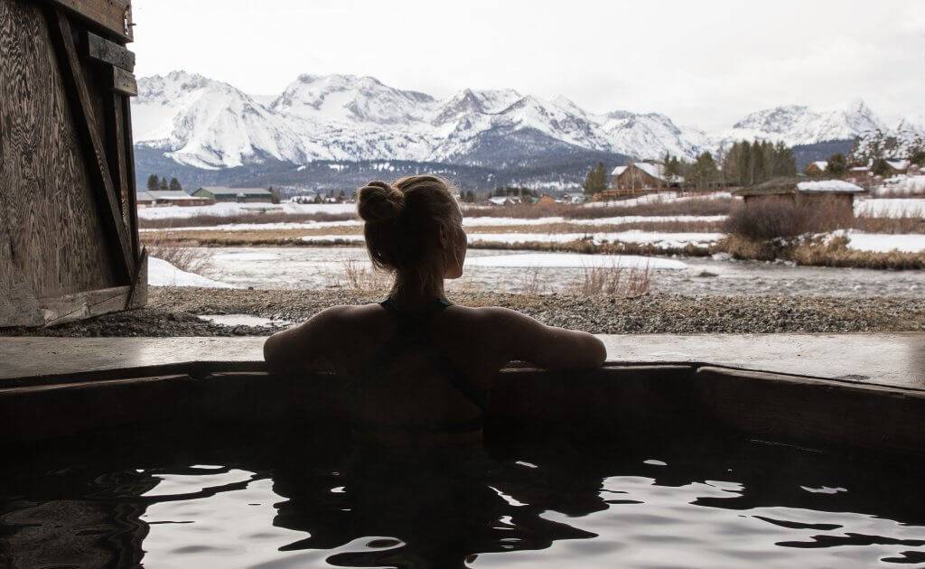 woman sitting in hot pool