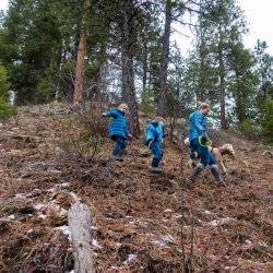 family hiking a hill